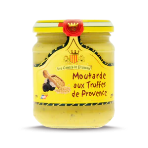 L'image montre un pot de moutarde de la marque "Les Comtes de Provence". Le pot est étiqueté "Moutarde aux Truffes de Provence". L'étiquette est jaune avec des détails noirs et rouges, et présente une illustration de graines de moutarde et de truffes. Le haut du pot est scellé avec un sceau rouge portant les initiales "CP". En bas à gauche de l'étiquette, il est écrit "Cuisiné en France".